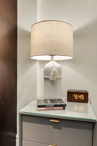 a bedroom with a bed and a mirror