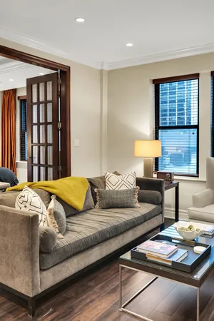 a bedroom with furniture and a window