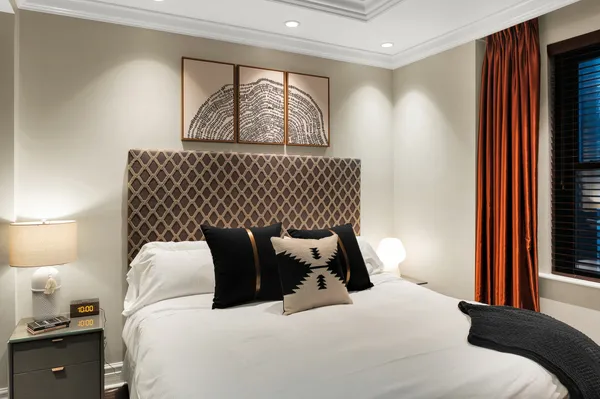 a bedroom with bed and window