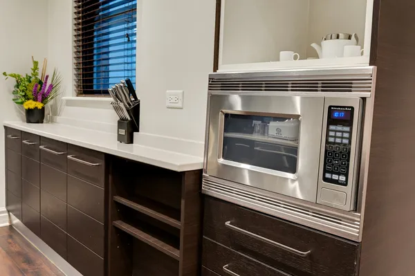 a kitchen with a sink and white stove