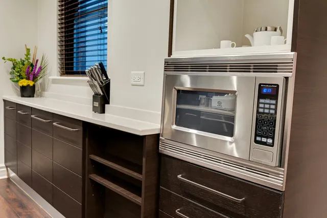 a kitchen with a sink and white stove