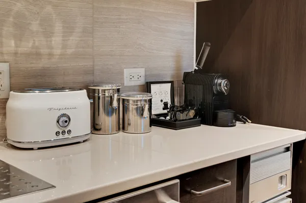 a view of a bedroom with furniture