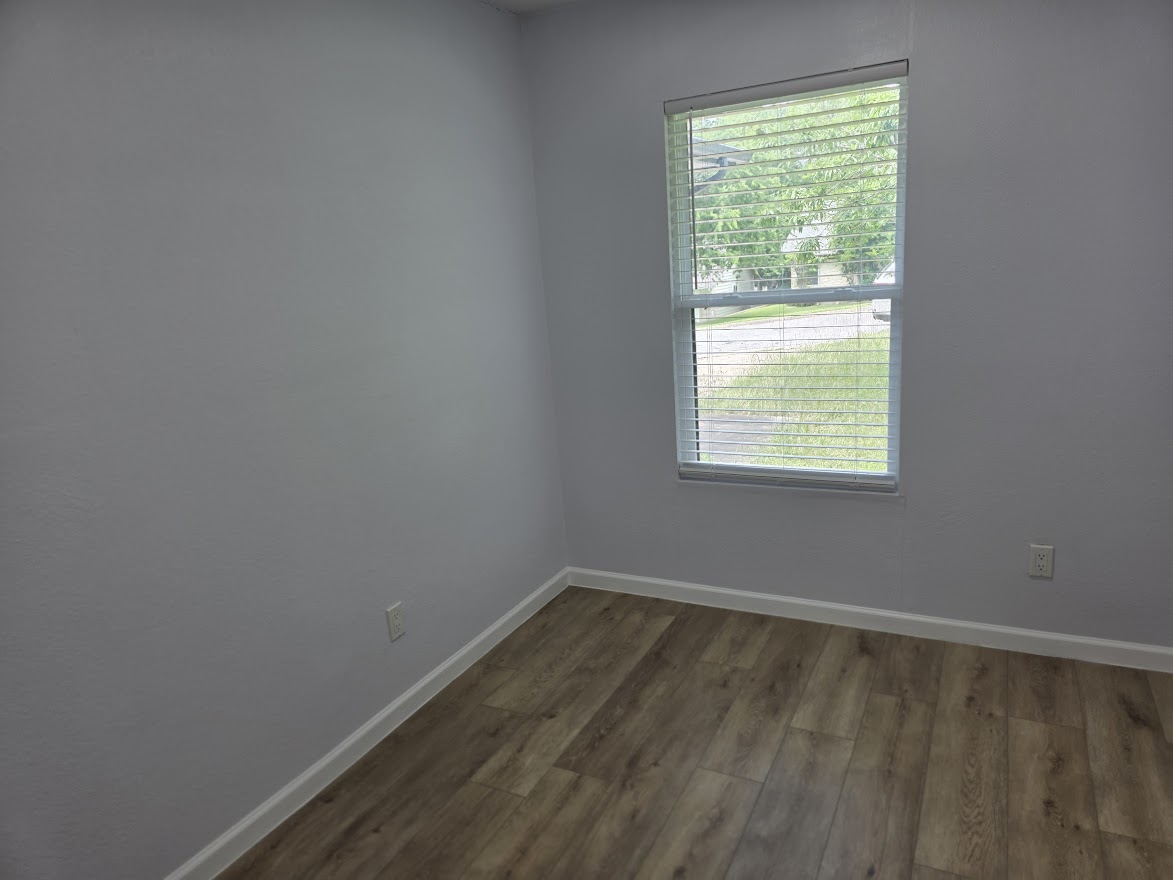 4803 Peach Grove Road Austin, TX 78744 - Photo 11 of 22 an empty room with a window