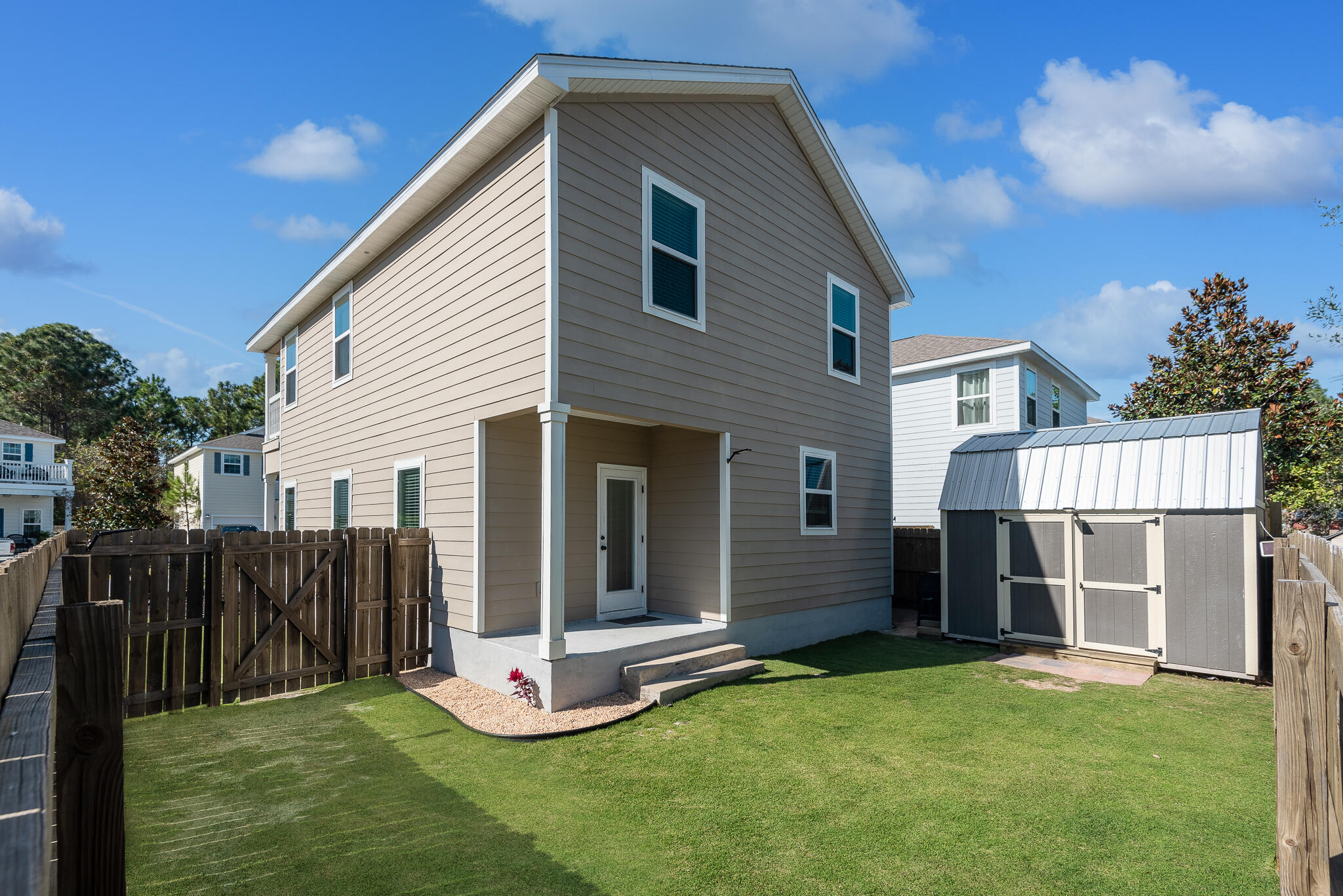 107 Mosaic Oaks Circle Santa Rosa Beach, FL 32459 - Photo 11 of 46 a front view of a house with a yard