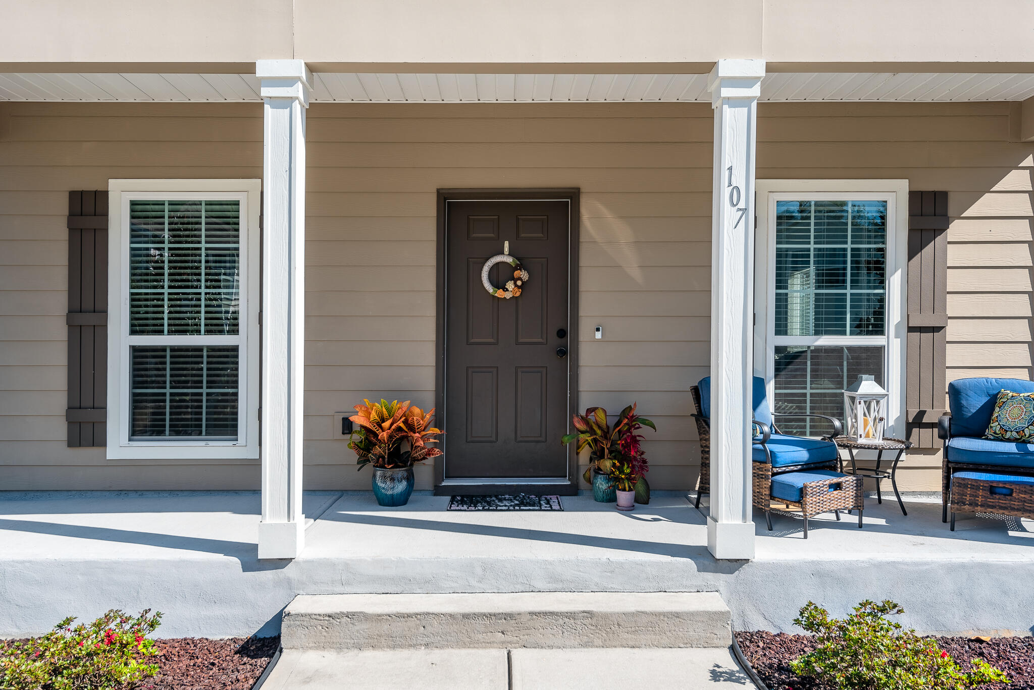 107 Mosaic Oaks Circle Santa Rosa Beach, FL 32459 - Photo 14 of 46 front view of a house with potted plants