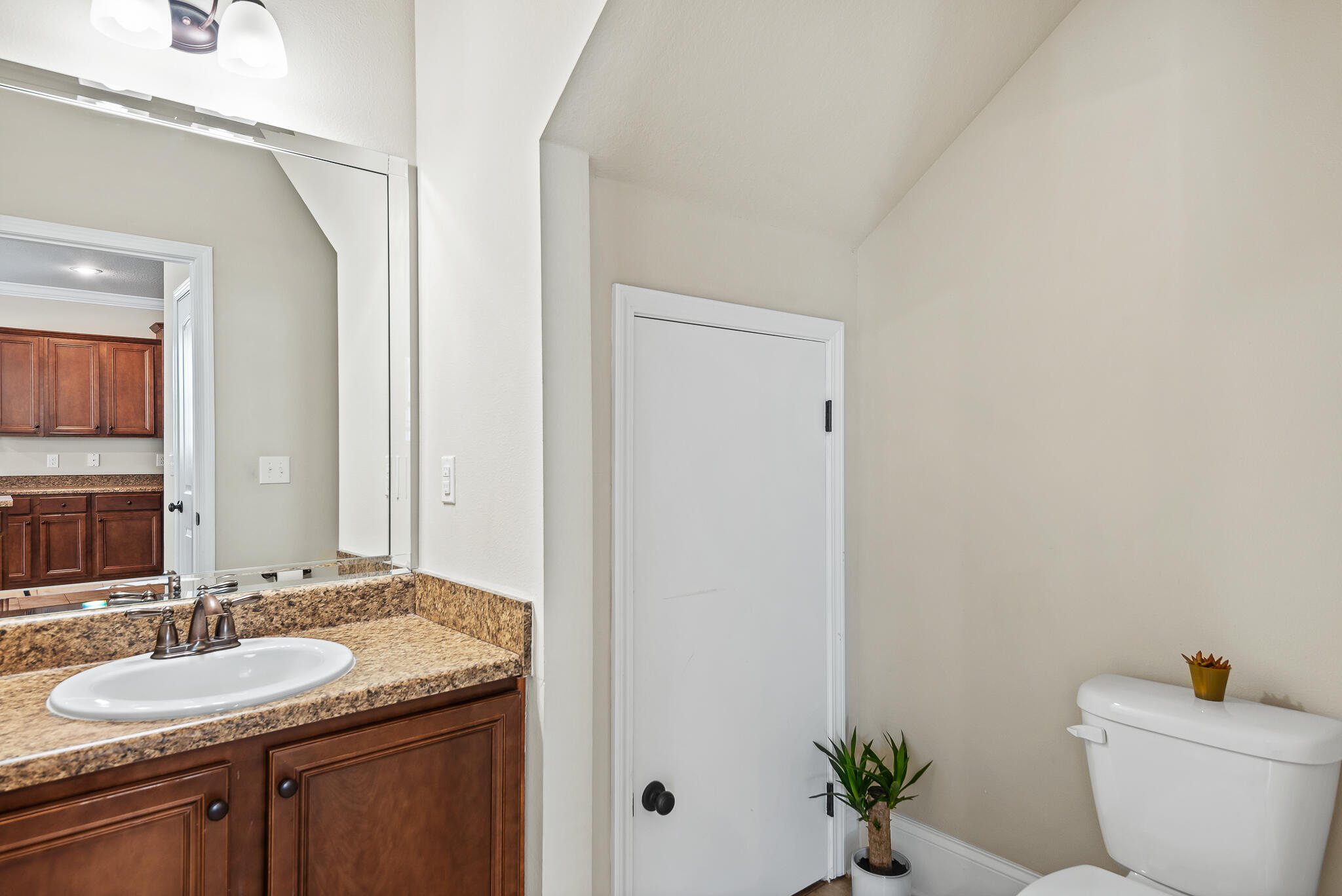 107 Mosaic Oaks Circle Santa Rosa Beach, FL 32459 - Photo 24 of 46 a bathroom with a granite countertop sink and a mirror