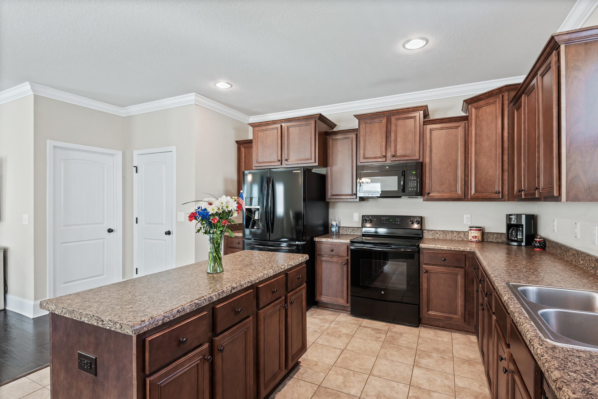 107 Mosaic Oaks Circle Santa Rosa Beach, FL 32459 - Photo 25 of 46 a kitchen with stainless steel appliances granite countertop a sink dishwasher stove and refrigerator