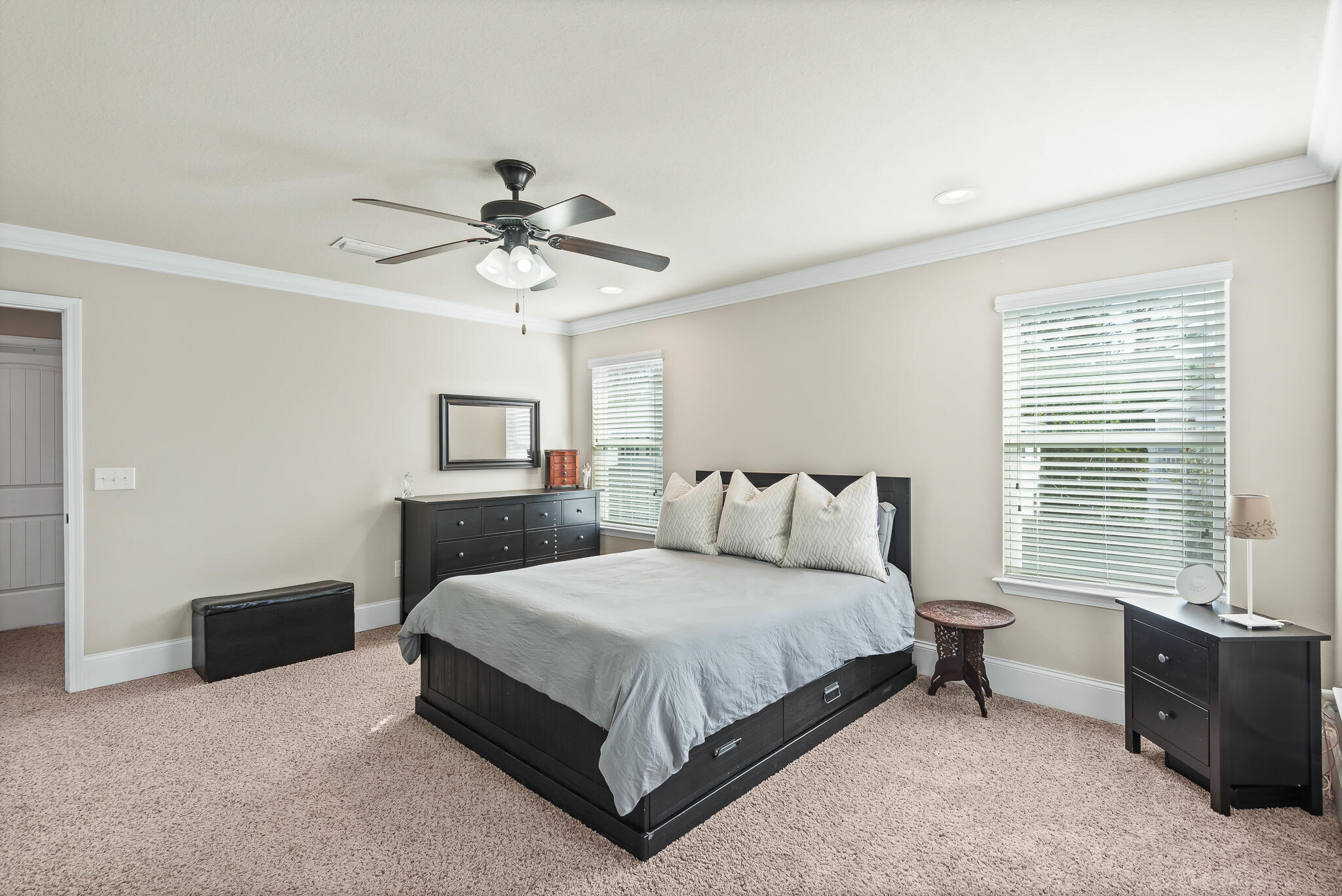 107 Mosaic Oaks Circle Santa Rosa Beach, FL 32459 - Photo 29 of 46 a bedroom with a bed and a chandelier