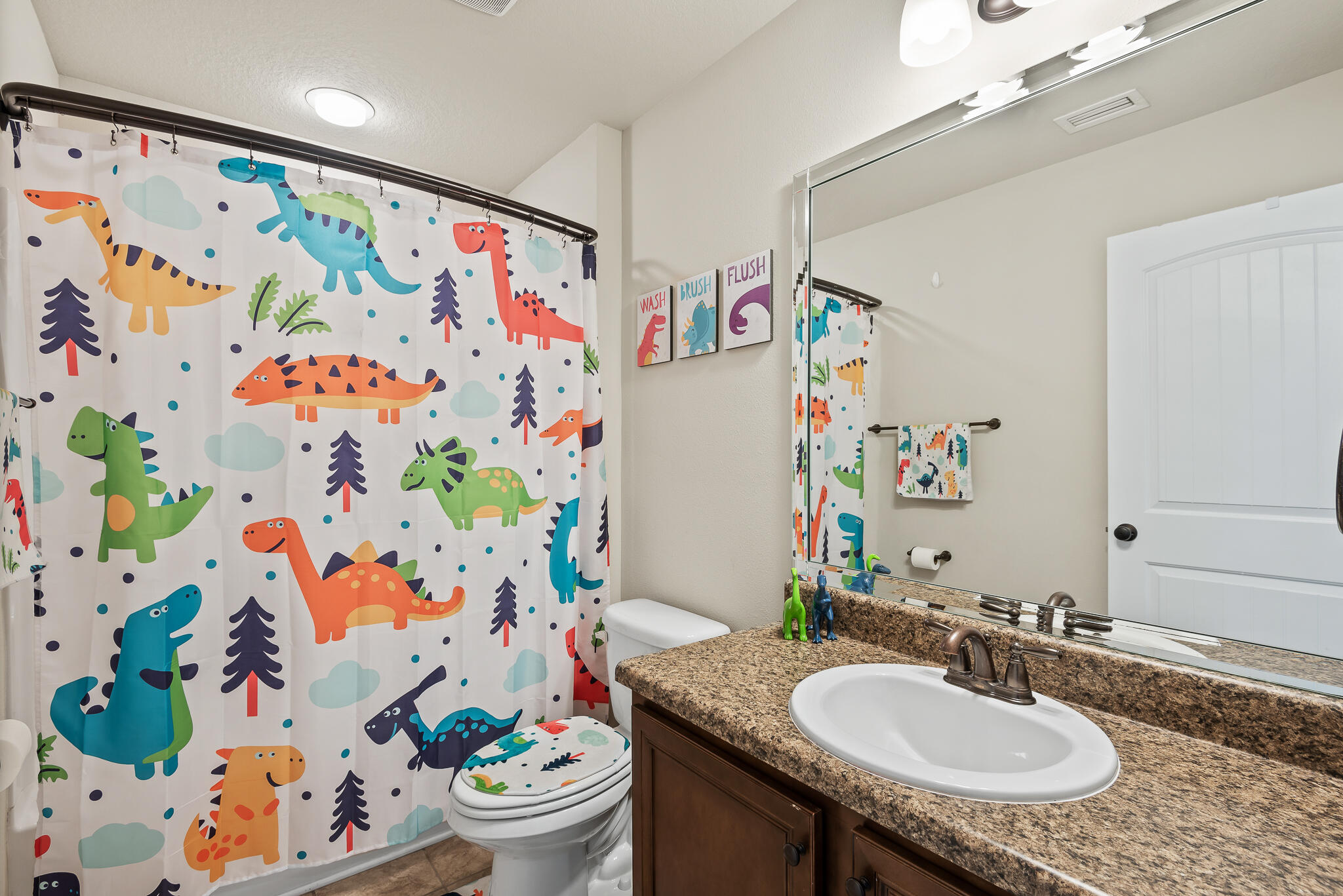 107 Mosaic Oaks Circle Santa Rosa Beach, FL 32459 - Photo 35 of 46 a bathroom with a granite countertop sink a vanity and a mirror
