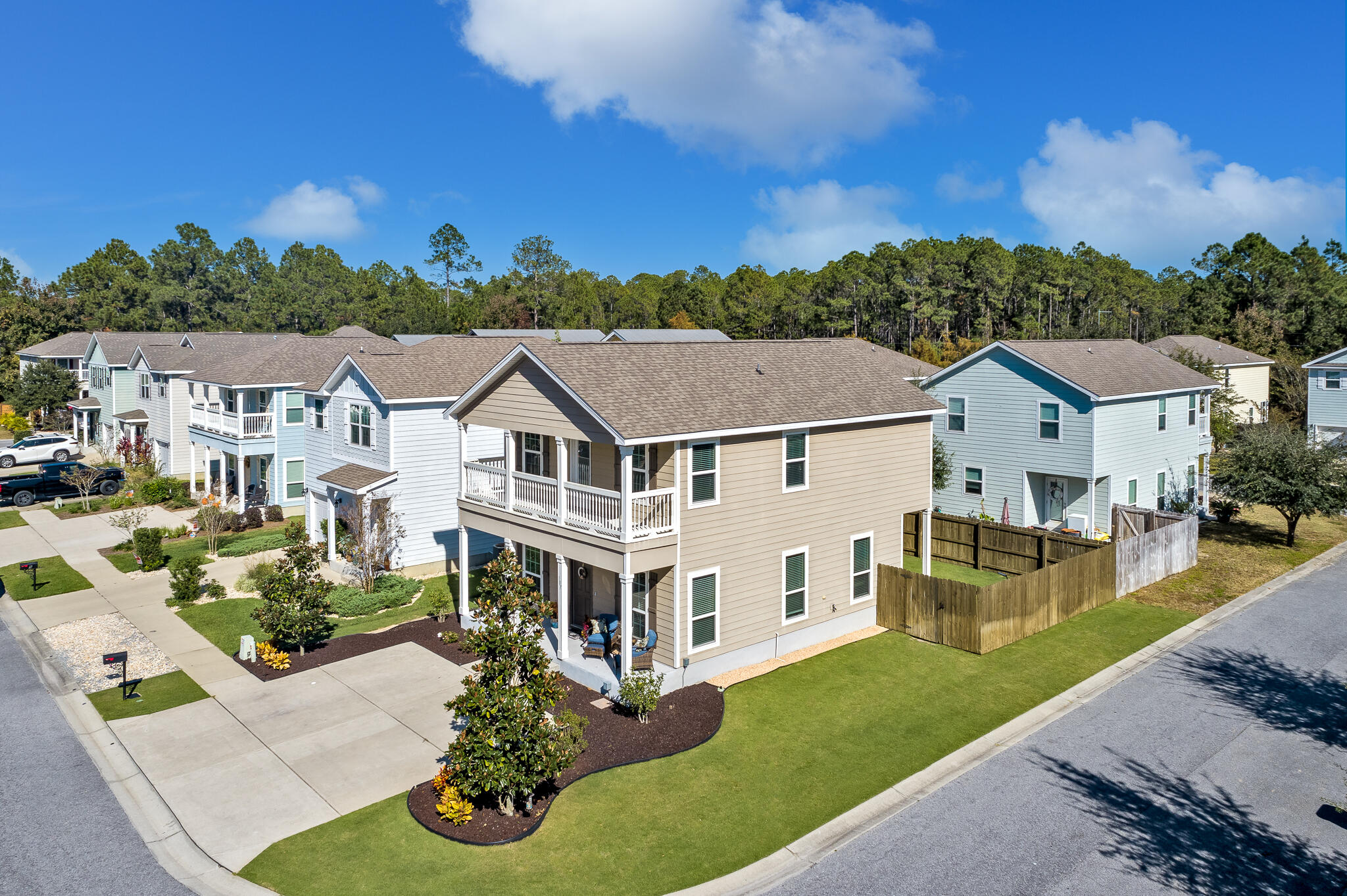 107 Mosaic Oaks Circle Santa Rosa Beach, FL 32459 - Photo 39 of 46 a aerial view of a house with a yard table and chairs