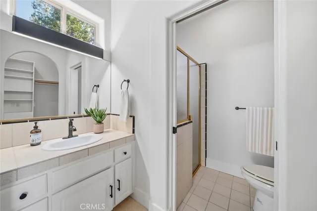 a bathroom with a double vanity sink and mirror