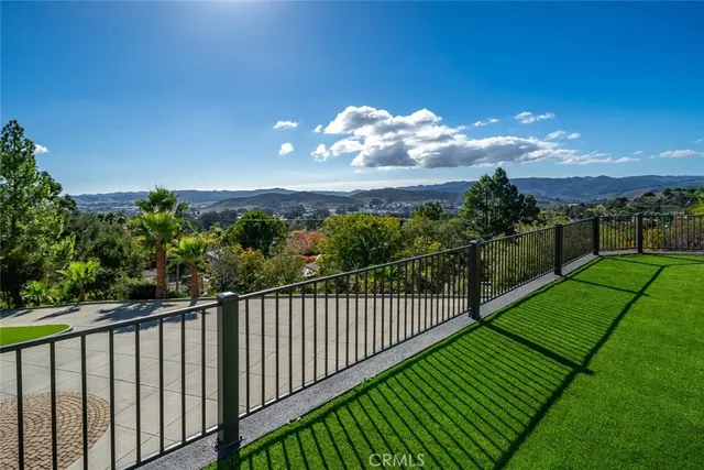 a view of a balcony with a garden