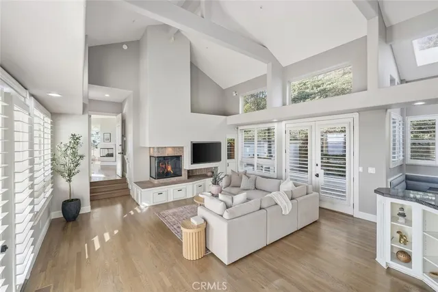 a living room with fireplace furniture and a flat screen tv