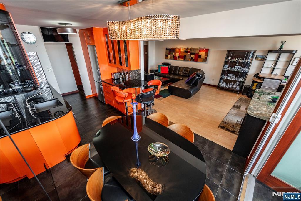 250 Gorge Road, Unit 8C Cliffside Park, NJ 07010 - Photo 11 of 43 a room with furniture and a flat screen tv