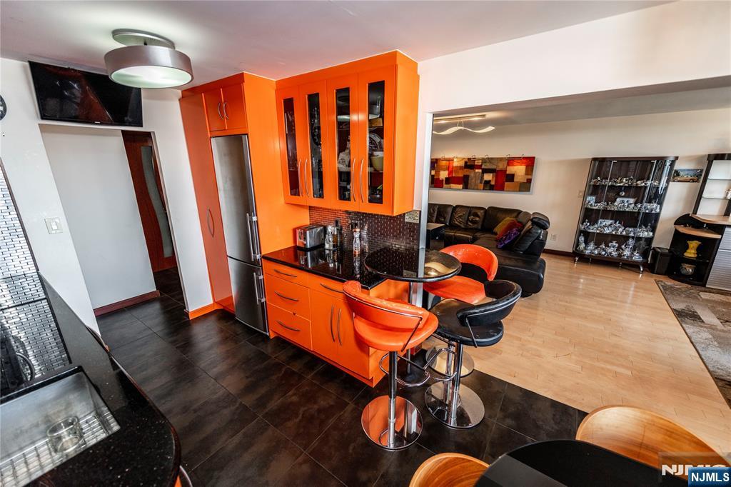 250 Gorge Road, Unit 8C Cliffside Park, NJ 07010 - Photo 13 of 43 a living room with furniture a rug and a large window