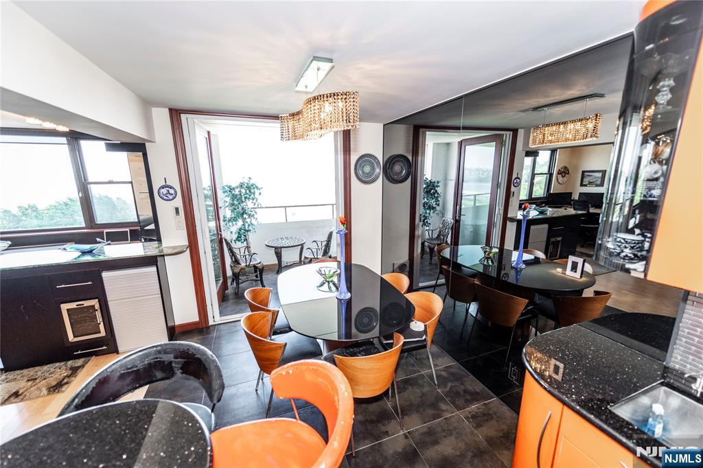 250 Gorge Road, Unit 8C Cliffside Park, NJ 07010 - Photo 16 of 43 a living room with furniture fireplace and a large window