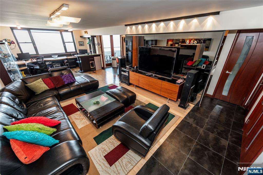 250 Gorge Road, Unit 8C Cliffside Park, NJ 07010 - Photo 17 of 43 a living room with furniture and a flat screen tv