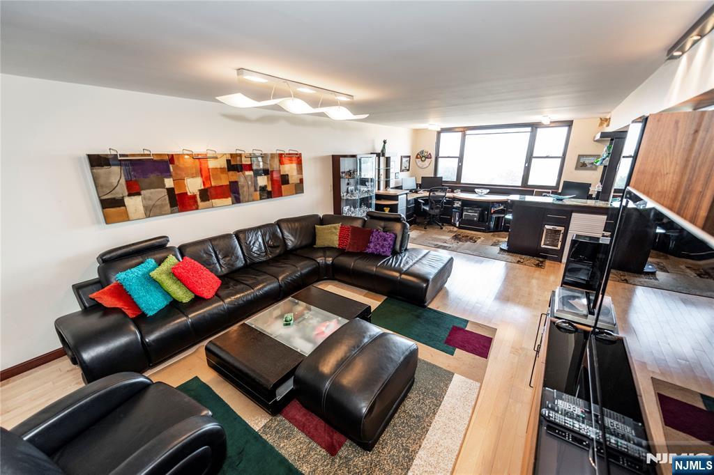 250 Gorge Road, Unit 8C Cliffside Park, NJ 07010 - Photo 19 of 43 a living room with furniture and a flat screen tv