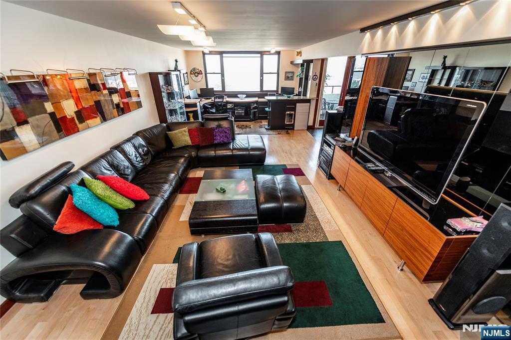 250 Gorge Road, Unit 8C Cliffside Park, NJ 07010 - Photo 20 of 43 a room with lots of furniture and clutter