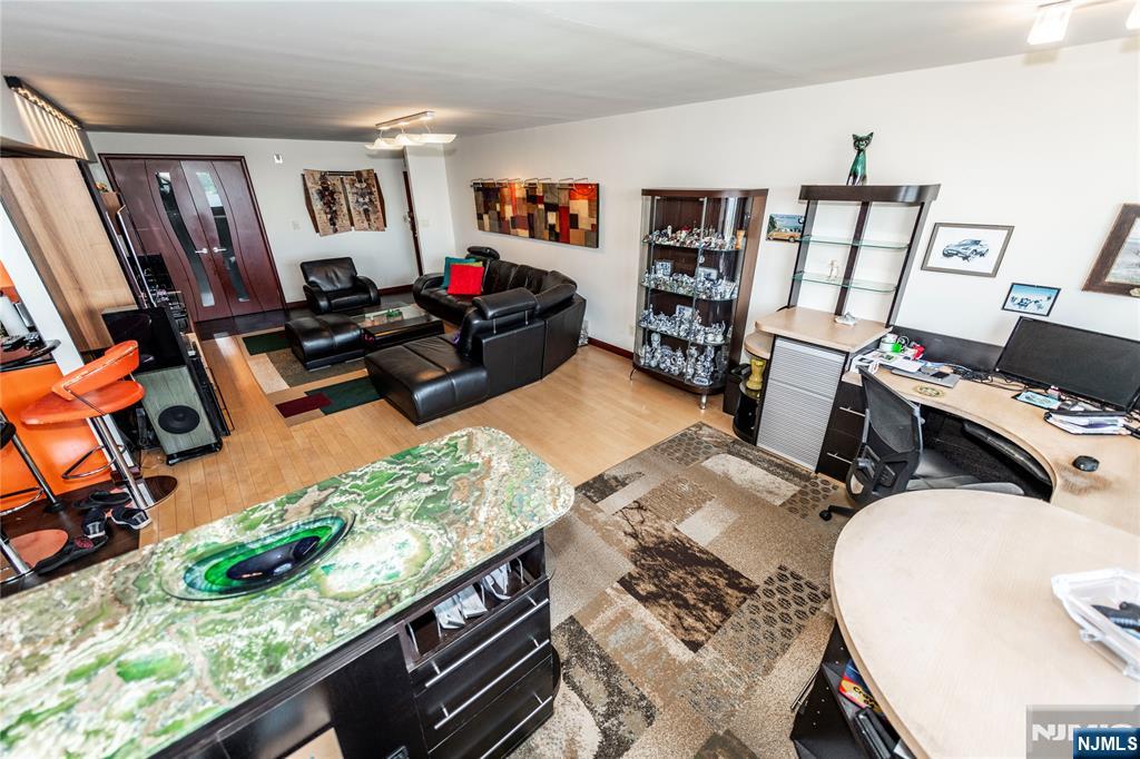 250 Gorge Road, Unit 8C Cliffside Park, NJ 07010 - Photo 21 of 43 a living room with furniture a rug and a window