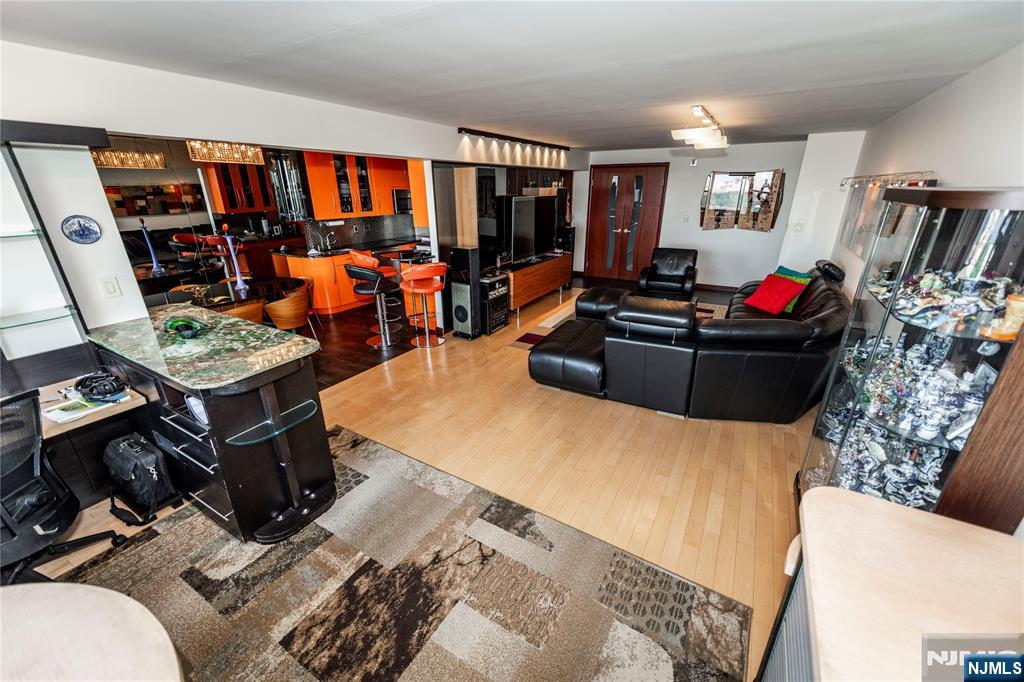 250 Gorge Road, Unit 8C Cliffside Park, NJ 07010 - Photo 22 of 43 a living room with furniture and a flat screen tv