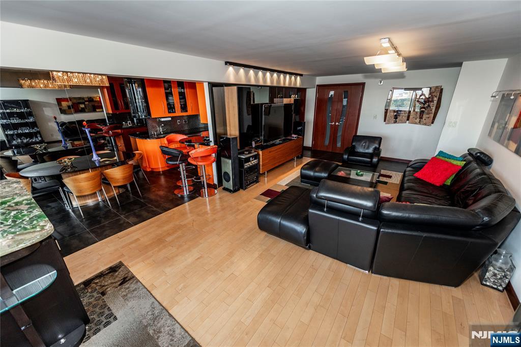 250 Gorge Road, Unit 8C Cliffside Park, NJ 07010 - Photo 23 of 43 a living room with furniture and a flat screen tv