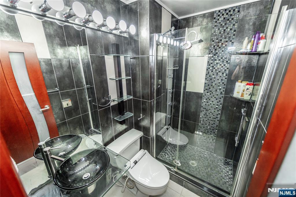 250 Gorge Road, Unit 8C Cliffside Park, NJ 07010 - Photo 29 of 43 a bathroom with a toilet and a shower