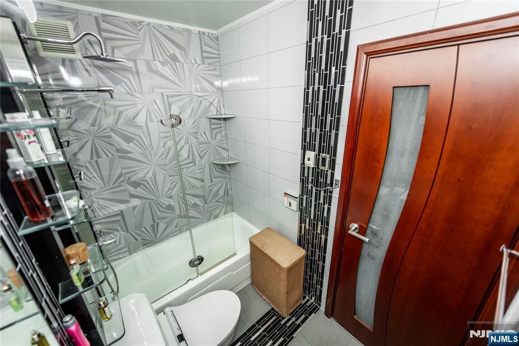250 Gorge Road, Unit 8C Cliffside Park, NJ 07010 - Photo 33 of 43 a bathroom with a toilet and shower