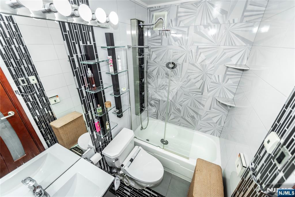 250 Gorge Road, Unit 8C Cliffside Park, NJ 07010 - Photo 34 of 43 a bathroom with a sink toilet and shower