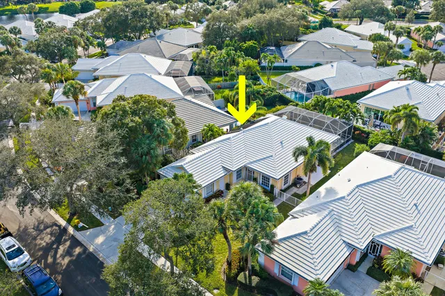 an aerial view of multiple houses with yard