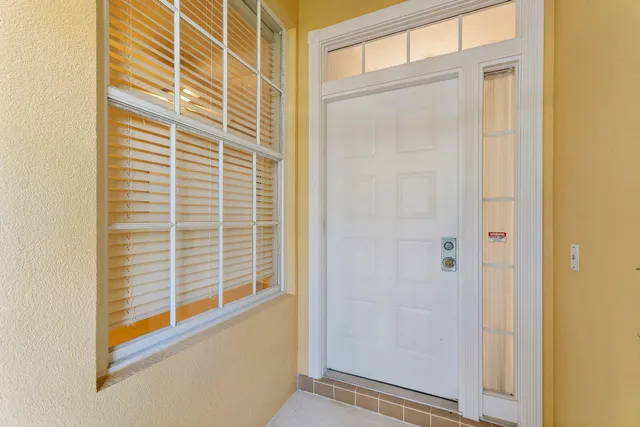 a view of a door and a window