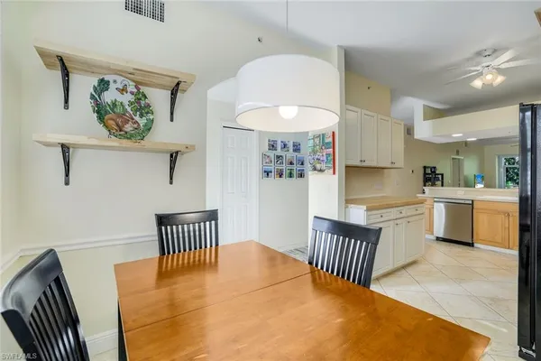 a view of a dining room with furniture and window