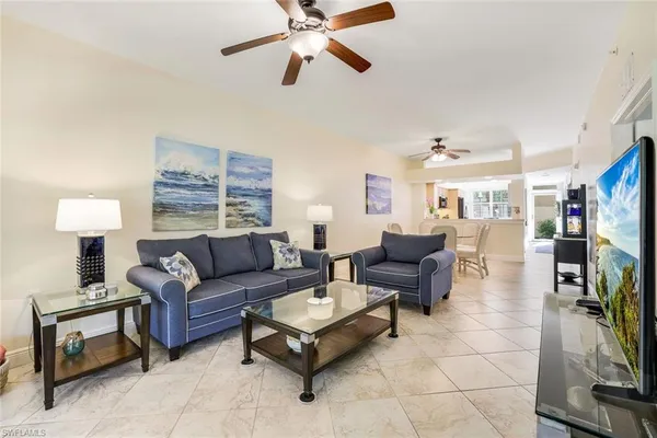 a living room with furniture and a window