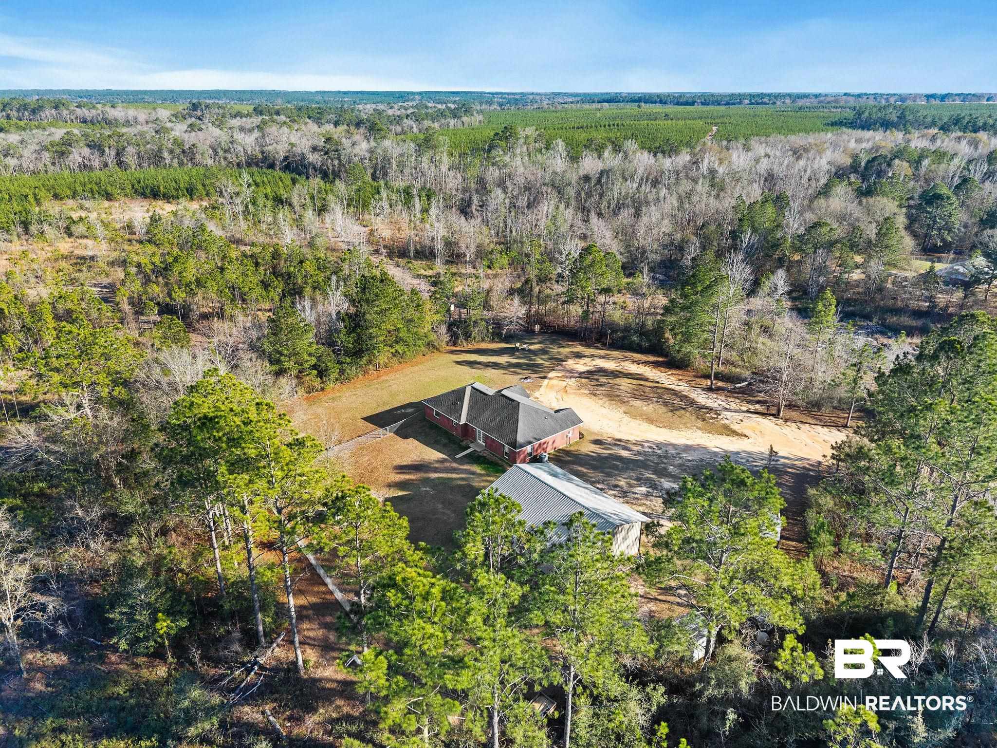 55750 Lottie Road Perdido, AL 36562 - Photo 18 of 84 View of subject property with a heavily wooded area