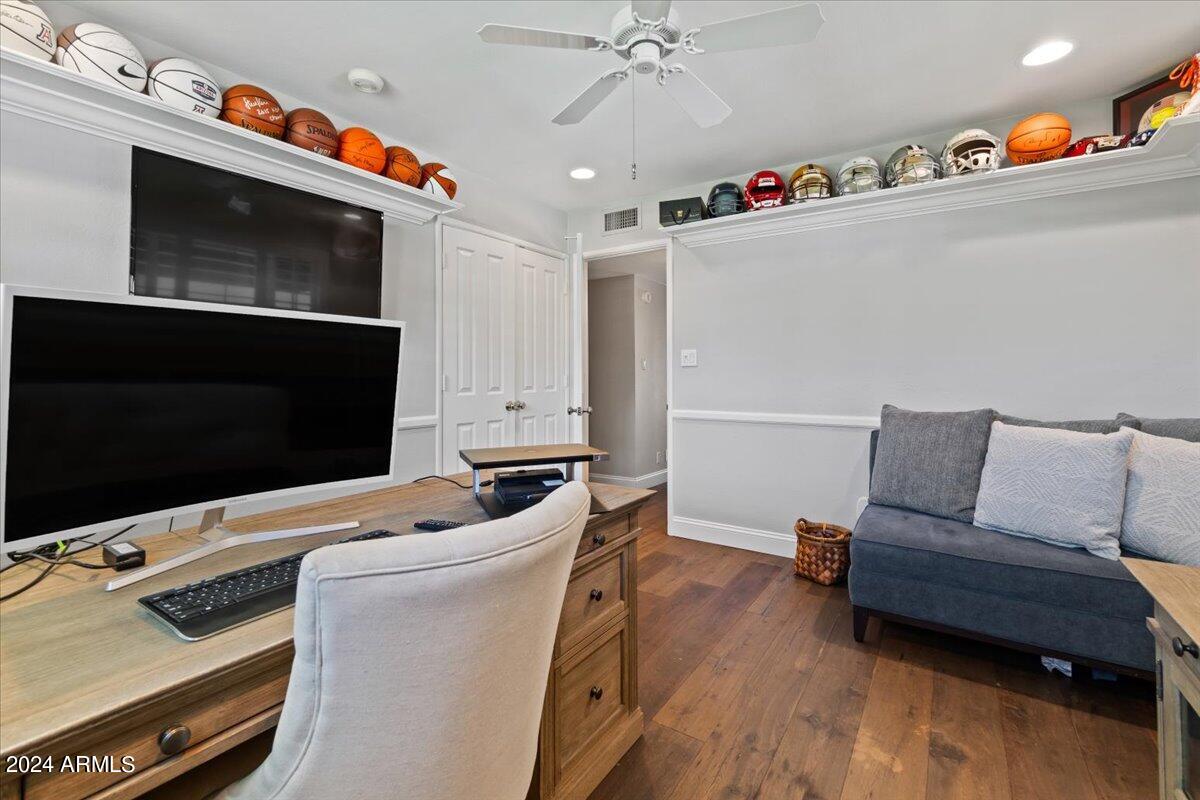3841 East Elm Street Phoenix, AZ 85018 - Photo 38 of 72 a living room with furniture and a flat screen tv