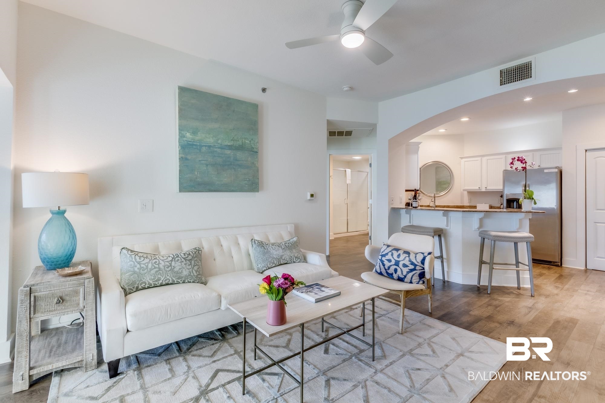 20050 Oak Road East Gulf Shores, AL 36542 - Photo 2 of 14 Living area with light wood-style floors, recessed lighting, a ceiling fan, and arched walkways