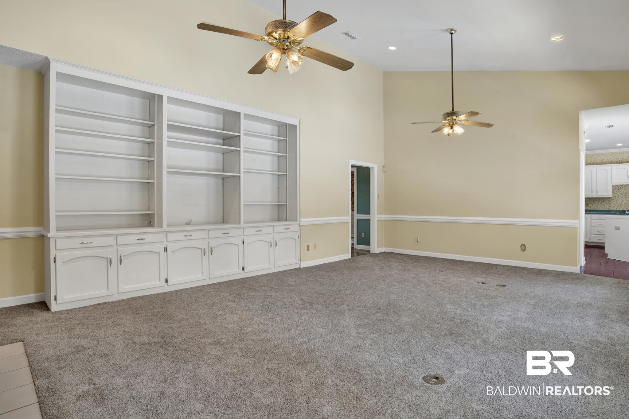 6805 Hunters Court Mobile, AL 36695 - Photo 10 of 37 Unfurnished living room featuring a ceiling fan, carpet, high vaulted ceiling, baseboards, and recessed lighting