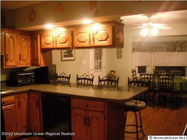 1302 Logan Road Asbury Park, NJ 07712 - Photo 2 of 7 a kitchen with sink and view of living room