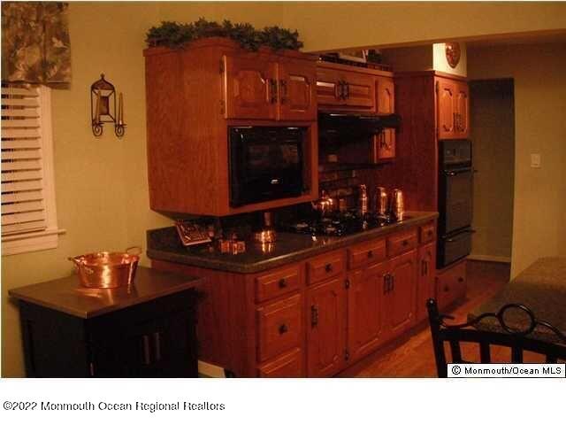1302 Logan Road Asbury Park, NJ 07712 - Photo 3 of 7 a black and white photo of a living room