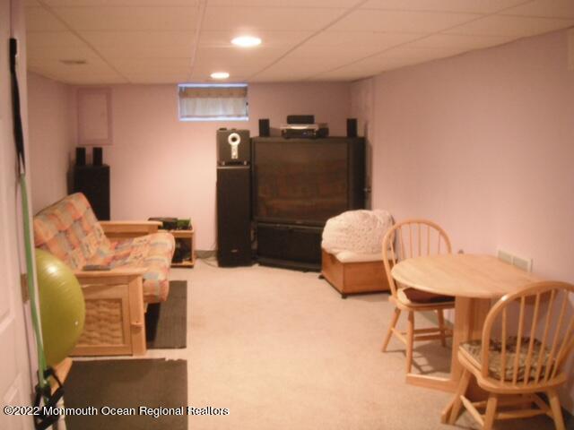 1302 Logan Road Asbury Park, NJ 07712 - Photo 4 of 7 a kitchen with stainless steel appliances kitchen island granite countertop furniture and a refrigerator