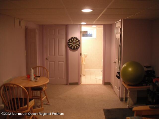 1302 Logan Road Asbury Park, NJ 07712 - Photo 5 of 7 a view of a livingroom with furniture and tub
