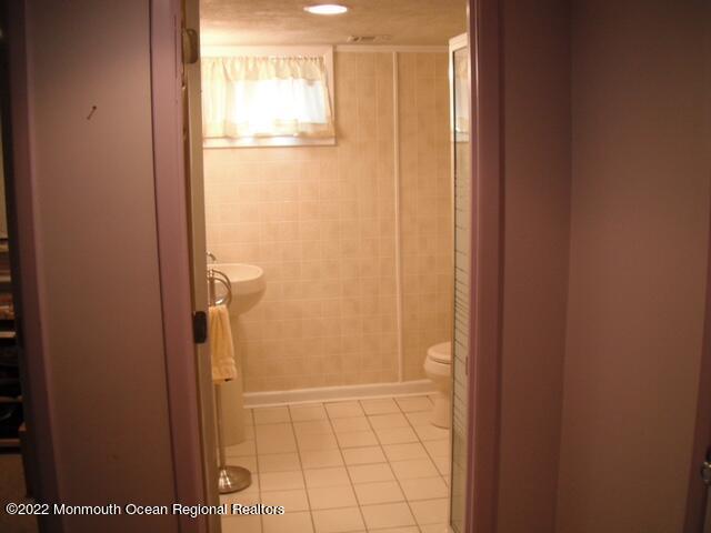 1302 Logan Road Asbury Park, NJ 07712 - Photo 6 of 7 a view of bathroom with shower