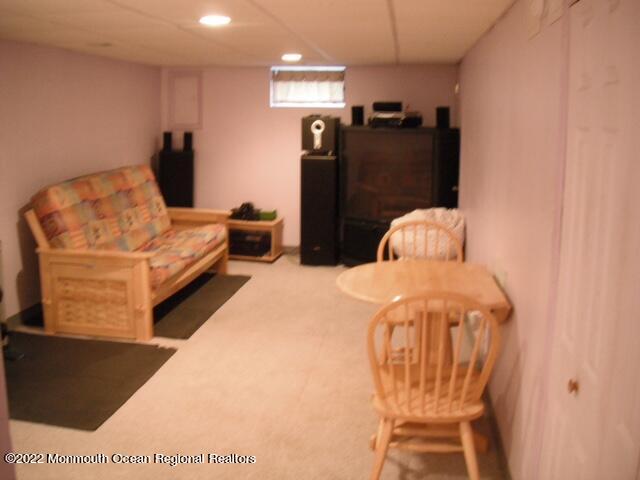 1302 Logan Road Asbury Park, NJ 07712 - Photo 7 of 7 a bedroom with a bed and wooden floor