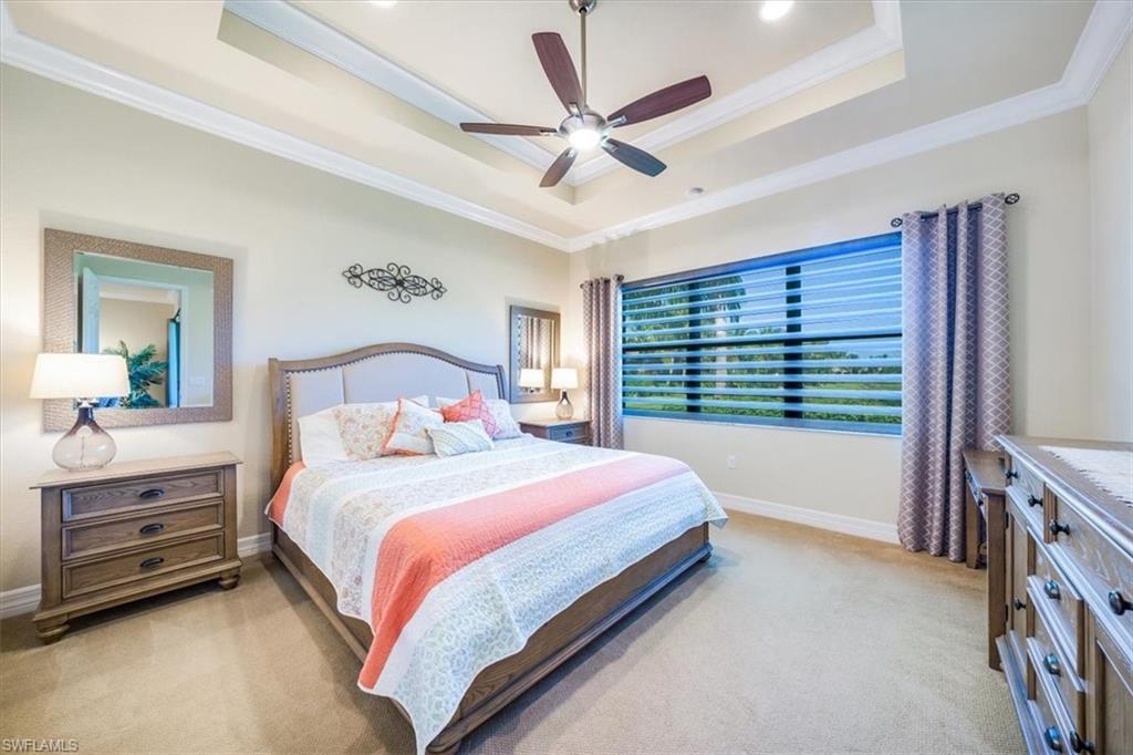 13474 Sumter Lane Naples, FL 34109 - Photo 17 of 25 a bedroom with a bed and a large window