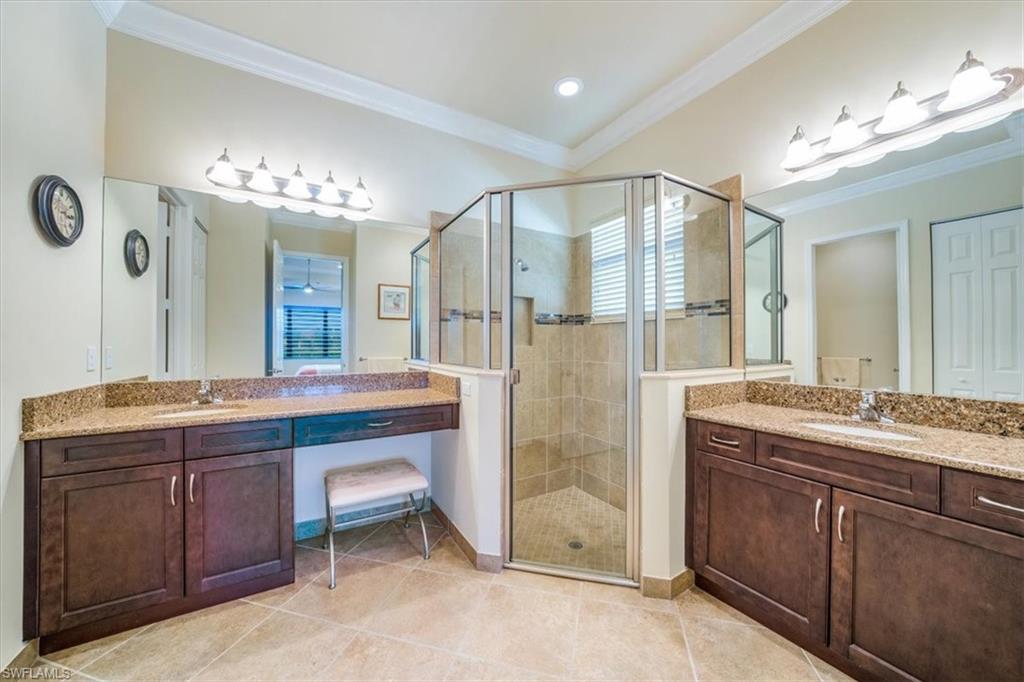 13474 Sumter Lane Naples, FL 34109 - Photo 19 of 25 a bathroom with a double vanity sink and a mirror