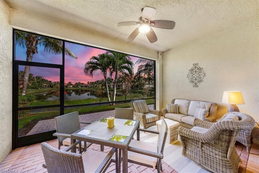 13474 Sumter Lane Naples, FL 34109 - Photo 2 of 25 a living room with furniture and a floor to ceiling window