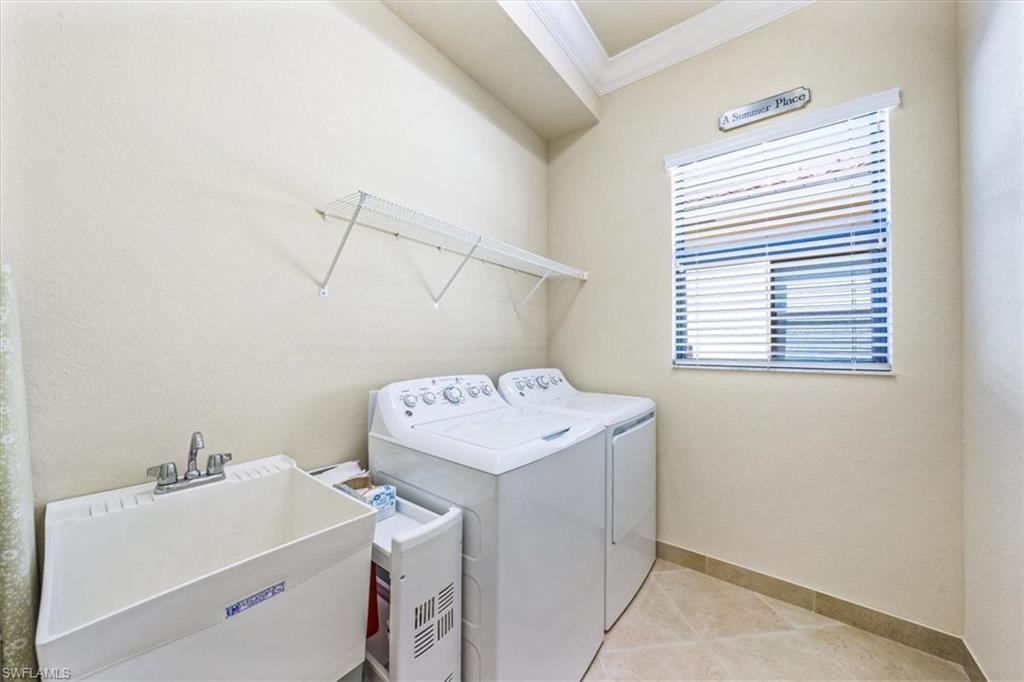 13474 Sumter Lane Naples, FL 34109 - Photo 23 of 25 a utility room with dryer and washer
