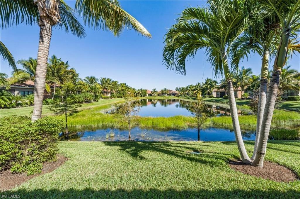 13474 Sumter Lane Naples, FL 34109 - Photo 25 of 25 a view of a backyard with a garden and swimming pool