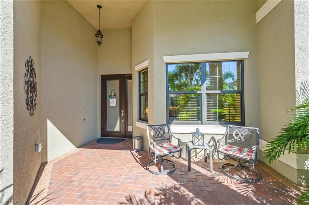 13474 Sumter Lane Naples, FL 34109 - Photo 5 of 25 a bedroom with furniture and a window