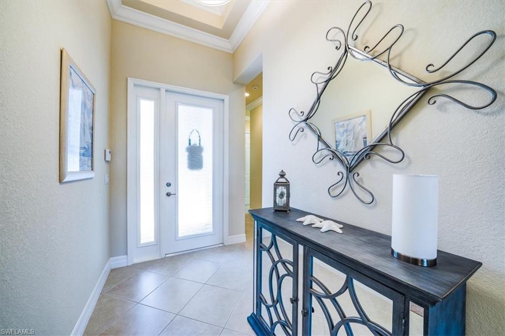 13474 Sumter Lane Naples, FL 34109 - Photo 6 of 25 a view of a hallway with seating area